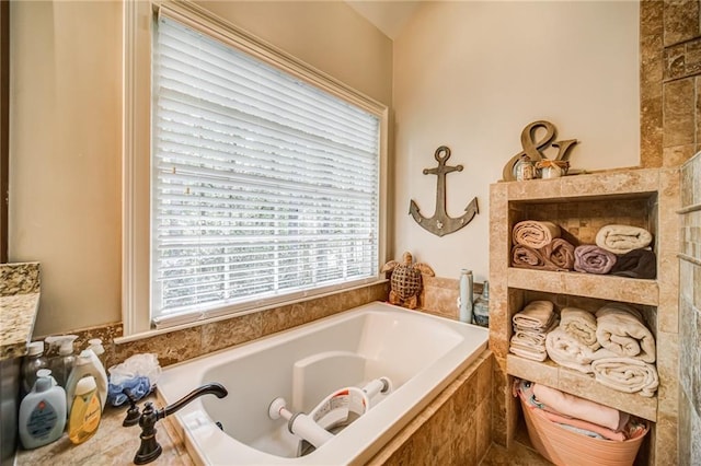 bathroom featuring tiled bath