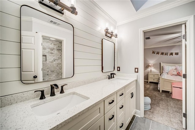 bathroom featuring ornamental molding, dual vanity, and tile flooring