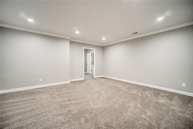 unfurnished room with crown molding and light colored carpet