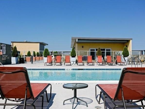 view of pool with a patio and fence