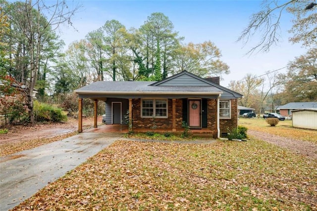 bungalow featuring a carport