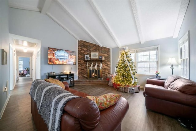 living room featuring a fireplace, vaulted ceiling with beams, and hardwood / wood-style flooring