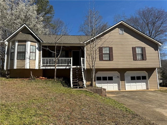 view of front of property with a porch, a garage, driveway, stairway, and a front yard