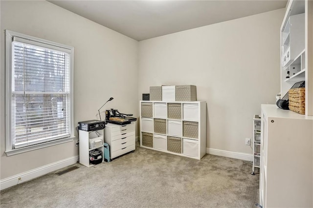 interior space featuring carpet flooring, visible vents, and baseboards