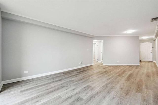 unfurnished room with light wood-type flooring