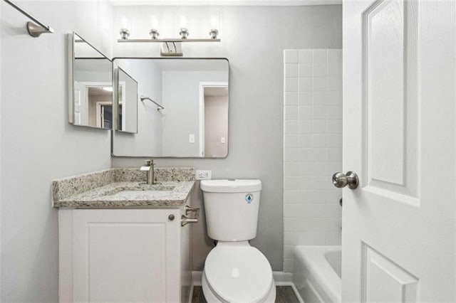 full bathroom featuring vanity, tub / shower combination, and toilet