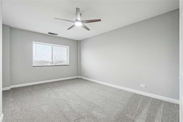 spare room with carpet flooring and ceiling fan