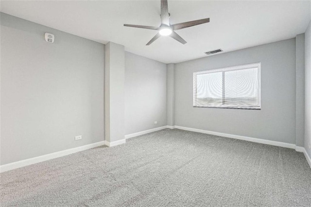 unfurnished room with ceiling fan and carpet floors