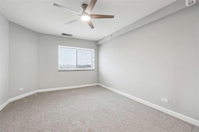 empty room with ceiling fan and carpet flooring