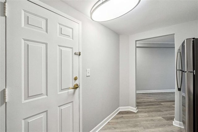 doorway with light hardwood / wood-style flooring