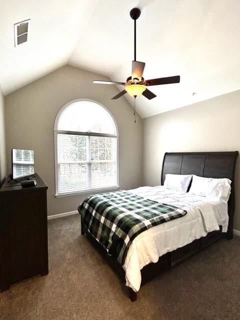 bedroom with lofted ceiling, dark carpet, baseboards, and ceiling fan