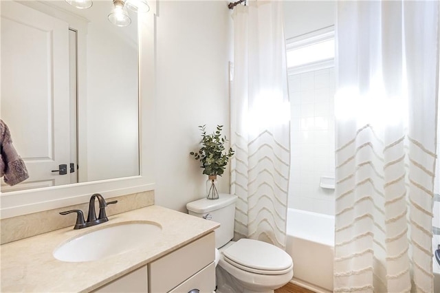 full bathroom with toilet, shower / bath combo, and vanity