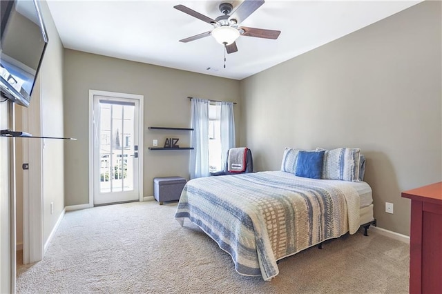 bedroom with access to exterior, multiple windows, baseboards, and light colored carpet