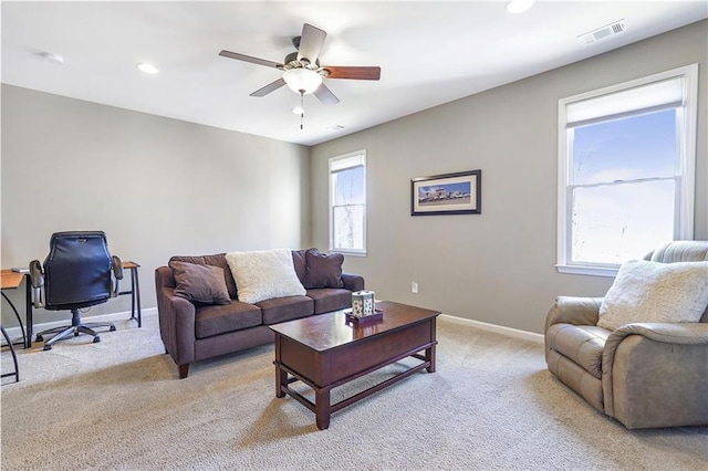 living room with recessed lighting, visible vents, light carpet, ceiling fan, and baseboards