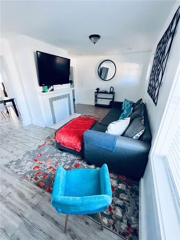 living room featuring a fireplace and hardwood / wood-style floors