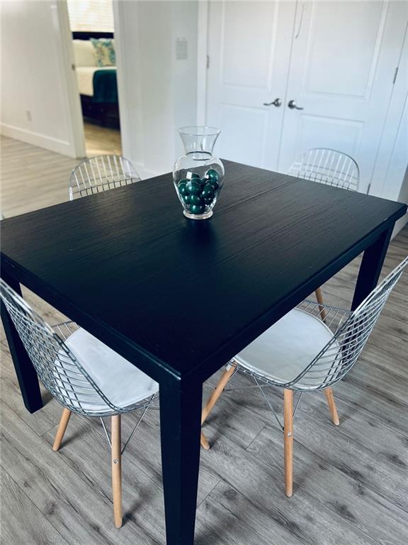 dining room featuring wood-type flooring