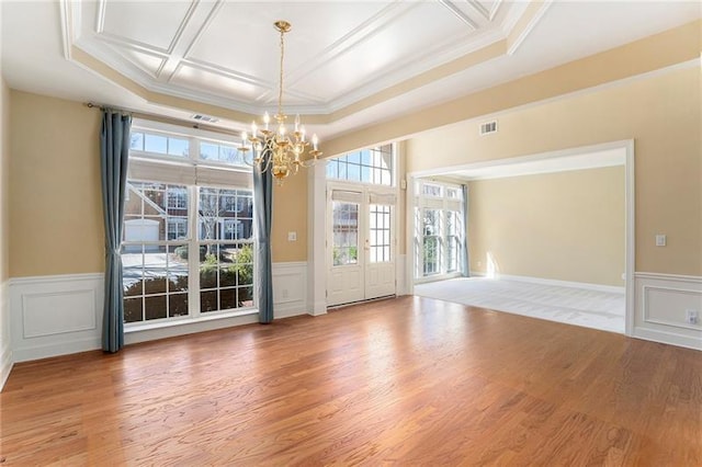 3505 Belridge Ln, Smyrna, GA 30080 - unfurnished room with a chandelier, a wainscoted wall, ornamental molding, wood finished floors, and a decorative wall