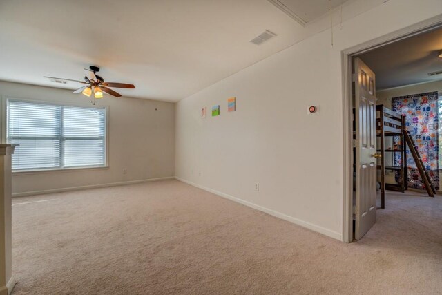 empty room with light carpet and ceiling fan