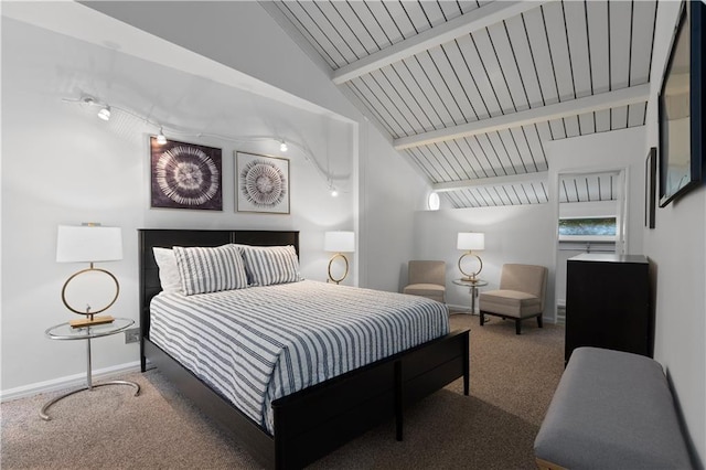 bedroom featuring lofted ceiling with beams, wooden ceiling, and carpet