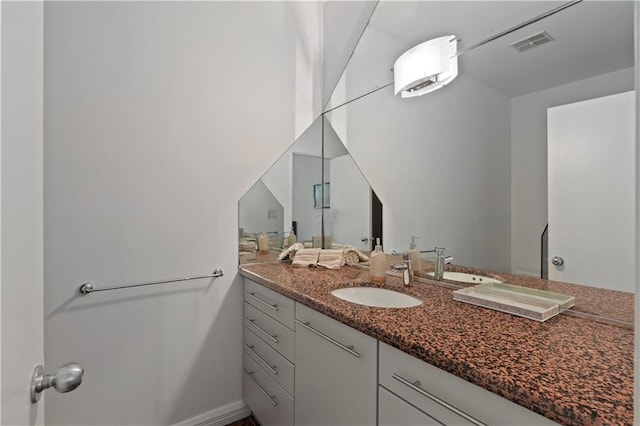 bathroom with vanity and a wall unit AC