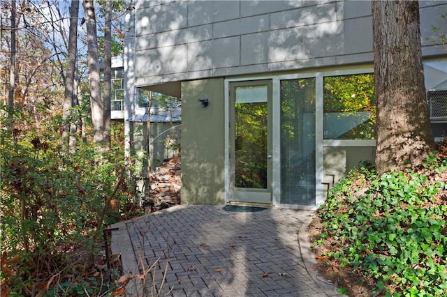 doorway to property featuring a patio