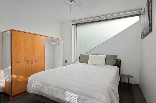 carpeted bedroom featuring a closet