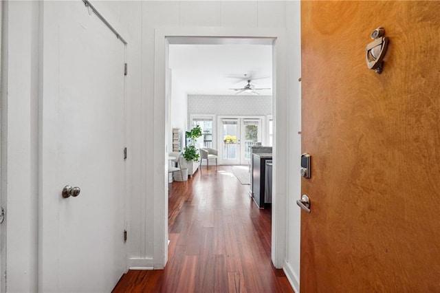 hallway featuring dark wood finished floors