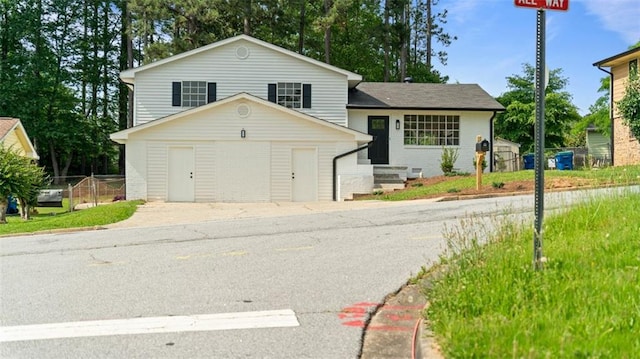 3735 Benchmark Dr, Atlanta, GA 30349 - tri-level home featuring brick siding and concrete driveway