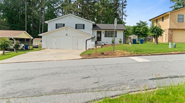 3735 Benchmark Dr, Atlanta, GA 30349 - tri-level home featuring concrete driveway and a front yard