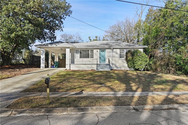 single story home featuring a front lawn and a carport