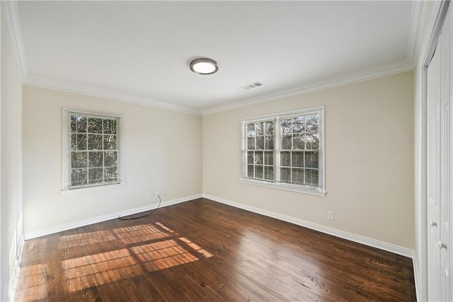 unfurnished room with dark wood-type flooring and ornamental molding