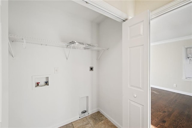 clothes washing area with washer hookup and hookup for an electric dryer