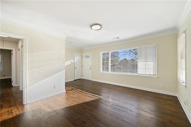 foyer entrance featuring dark hardwood / wood-style flooring and ornamental molding