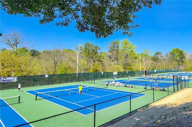 view of tennis court with fence