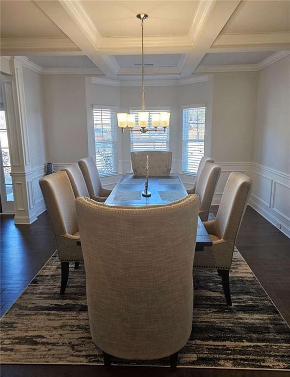 dining area with dark wood-style floors, an inviting chandelier, beam ceiling, and a healthy amount of sunlight