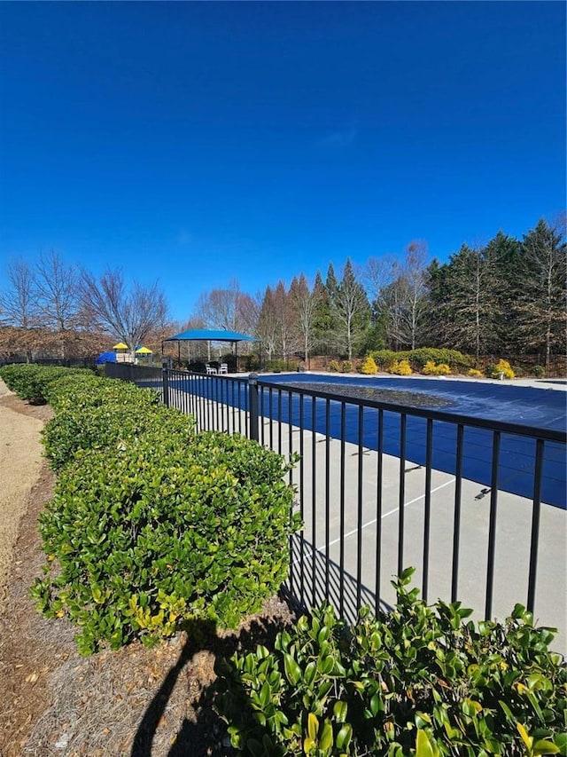 view of pool with fence