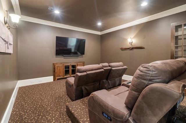 carpeted home theater room featuring ornamental molding, recessed lighting, visible vents, and baseboards