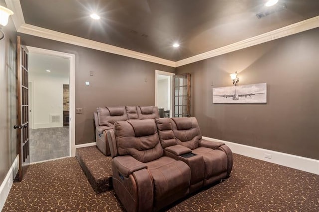 carpeted cinema room with recessed lighting, visible vents, crown molding, and baseboards