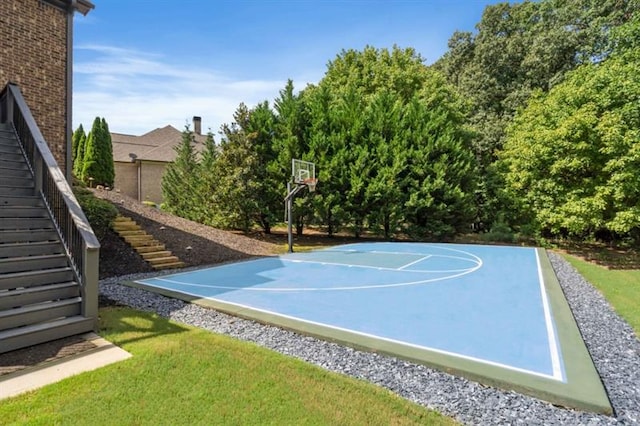 view of sport court featuring community basketball court and stairway