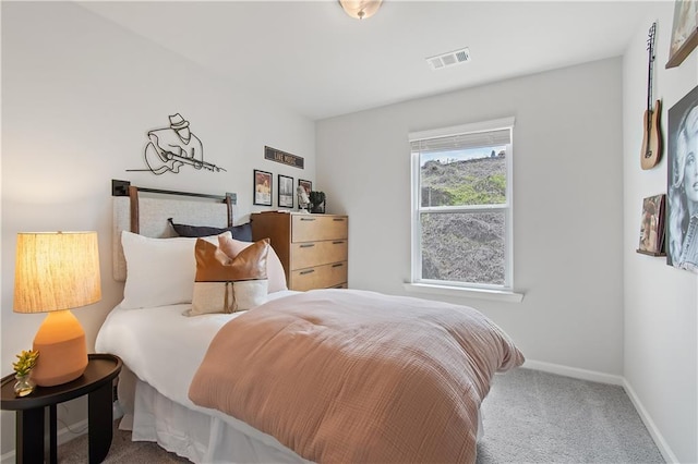 bedroom featuring carpet, visible vents, and baseboards