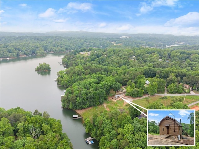 2109 Pine Tree Cir, Gainesville, GA 30501 - aerial view of property and surrounding area featuring a nearby body of water, property boundaries highlighted, and a heavily wooded area