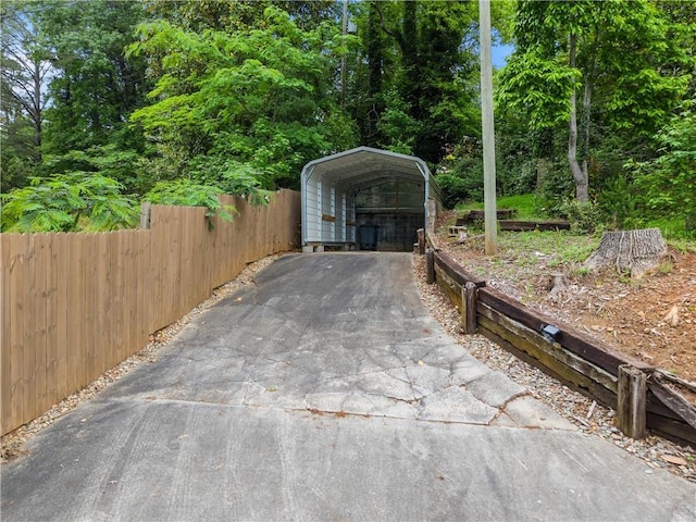 2109 Pine Tree Cir, Gainesville, GA 30501 - view of parking / parking lot featuring a carport and asphalt driveway