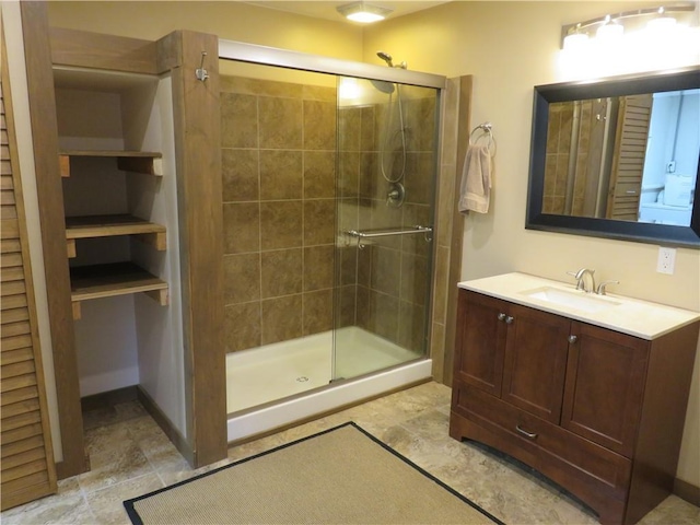 full bathroom featuring a shower stall and vanity