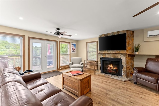 2109 Pine Tree Cir, Gainesville, GA 30501 - living area with ceiling fan, light wood-style floors, a wall mounted air conditioner, a fireplace, and recessed lighting