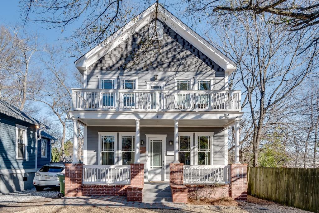 view of front of house with a balcony and covered porch