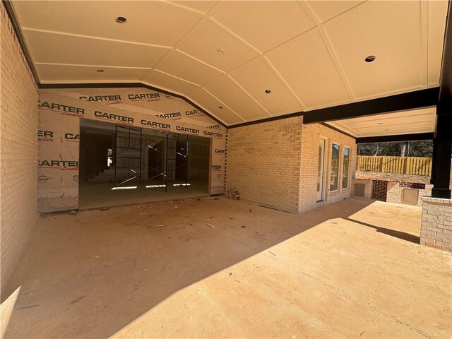 miscellaneous room featuring vaulted ceiling