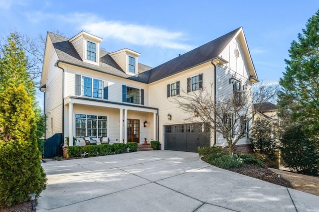 view of front of property with a garage and a porch