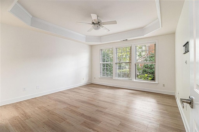 401 Wellwood Way, Roswell, GA 30075 - unfurnished room with a raised ceiling, ornamental molding, a ceiling fan, and light wood-style floors