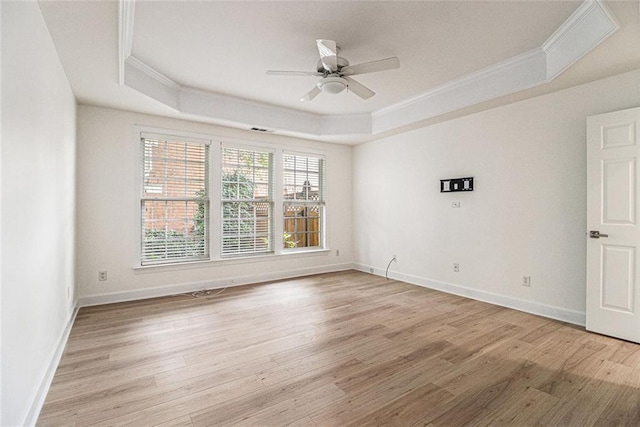 401 Wellwood Way, Roswell, GA 30075 - unfurnished room with a raised ceiling, ornamental molding, light wood-style flooring, and ceiling fan