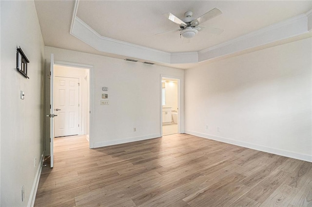 401 Wellwood Way, Roswell, GA 30075 - spare room with crown molding, a raised ceiling, light wood-style flooring, and a ceiling fan